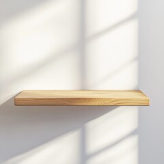 Empty light wooden shelf on white wall with sunlight shadows.