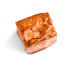 Piece of fried tofu cheese with soy sauce on white background