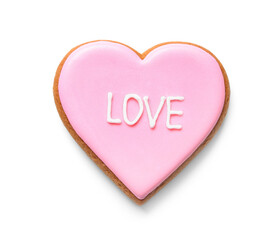 Pink heart shaped cookie with word LOVE on white background. Valentine's day celebration