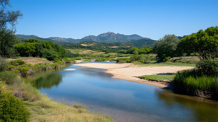 Calm river flows through lush valley, mountains in background; peaceful nature scene ideal for travel brochures