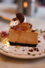 Plated slice of chocolate cheesecake at an upscale restaurant in downtown Minneapolis, Minnesota.