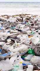 Marine debris, plastic waste on beach, polluted nature, dirty ocean pollution