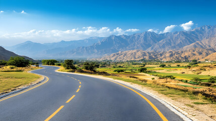 Naklejka premium Winding mountain road journey, scenic valley view, sunny day, travel destination