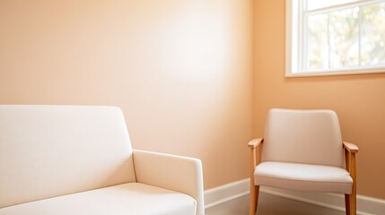 therapy room with neutral color palette featuring comfortable couch and chair both unoccupied