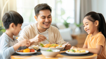 family enjoying meal together small table, sharing smiles and conversation. father and two children are seated, with plates of healthy food front of them, creating warm and joyful atmosphere