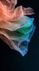 Fototapeta premium Abstract Pastel Fabric Texture Flowing Rainbow Gauze on Dark Background
