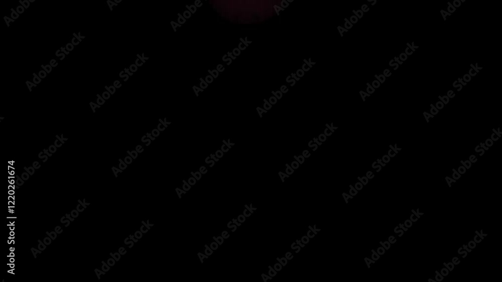 Poster violet ink swirl in water creating abstract symmetrical patterns on dark background
