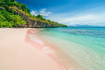 Fototapeta premium idyllic pink sand beach with shimmering turquoise sea water, showcasing a peaceful atmosphere with soft waves and distant islands