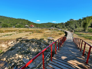 Scenic Passage: Walking Across Pai Bamboo Bridge, Mae Hong Son Loop, Northern Thailand.