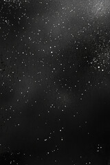 Fototapeta premium A transparent black distressed overlay background with faint texture details and tiny white particles evenly dispersed, resembling stars in a serene night sky, with a focus on depth and contrast 