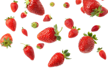 Falling red strawberries flying isolated on PNG cut out background. 