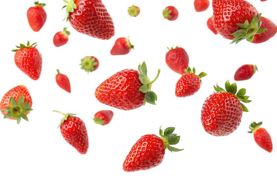 Falling red strawberries flying isolated on PNG cut out background. 