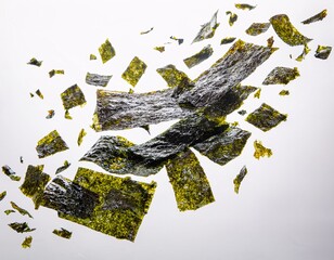 Nori Seaweed Flakes Falling in Mid-Air with White Clean Background