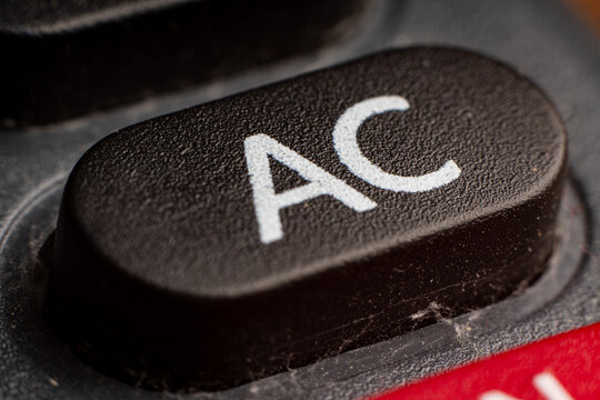 Closeup of a black electronic keypad button for calculating financial transactions in modern banking