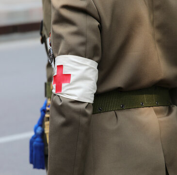 Vicenza, VI, Italy - June 2, 2022: symbol of red cross on the uniform of the doctor soldier