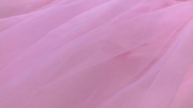 Soft pink tulle fabric texture that moves in the wind