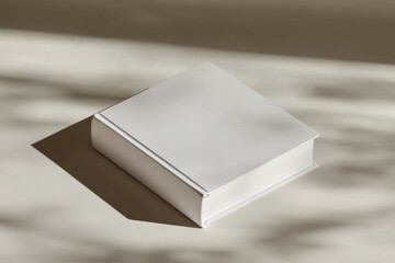 Minimalistic White Book on a Light Surface with Soft Shadows