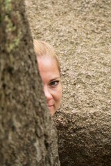 A young white woman travels through the summer of rocks and stones