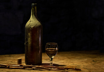 Bottle of white wine and a glass