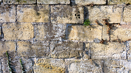 old weathered stone and rustic bricks wall background