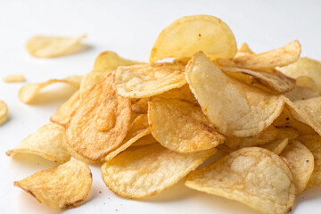 Fried flat potato chips, snacks, on a white background