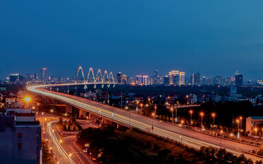 Fototapeta premium Nhat Tan Bridge at Night in Hanoi, Vietnam