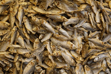 Mixed dried fish are displayed and sold at a fish market, Different types of dried fish along with hilsa are sold by a street vendor, All types of dried salted fish in the Asian biggest seafood market