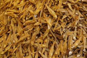 Mixed dried fish are displayed and sold at a fish market, Different types of dried fish along with hilsa are sold by a street vendor, All types of dried salted fish in the Asian biggest seafood market