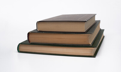 a stack of three books on a white background.