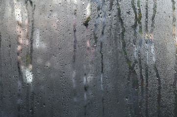  the background of wet glass. Water on the window.
