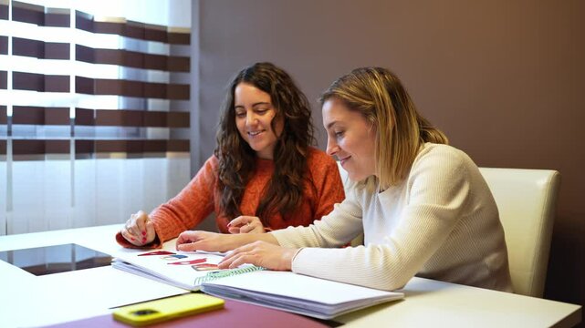 A visually impaired woman shares a braille book with her friend, promoting knowledge and inclusion in a warm and supportive environment - Powered by Adobe