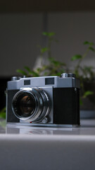 A vintage film camera is waiting for you on the table. When will you start taking pictures
