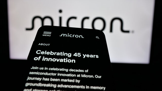 Stuttgart, Germany - 01-23-2025: Smartphone with website of US semiconductor company Micron Technology Inc. on screen in front of business logo. Focus on top-left of phone display.