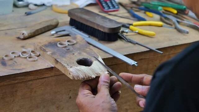 Jeweler at Work: Ring Crafting Process in Workshop