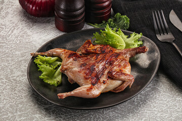 Grilled quail in the plate