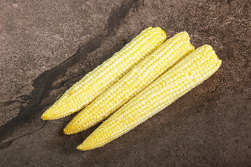 Raw sweet baby corn heap