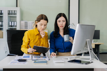 Diverse professionals collaborate on project analysis with financial graphs.