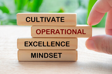 Cultivate operational excellence mindset text on wooden blocks. Culture of continuous improvement...