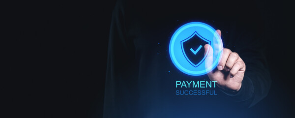 Secure payment success represented by a glowing shield with a tick, touched by a hand on a dark background. Digital transaction security concept.