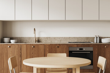 Modern kitchen interior with wooden cabinets and minimalist round dining table. 3D Rendering