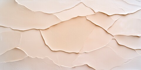 Obraz premium Textured Beige Surface with Layered Peel Patterns for Artistic Background Use