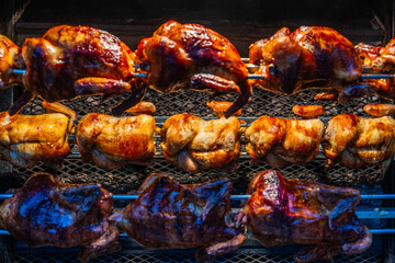 grilling whole chickens on the street