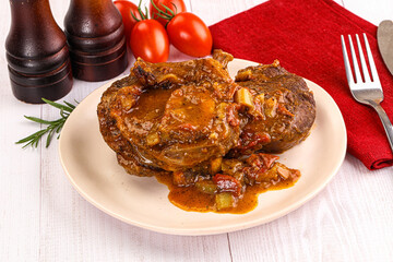 Italian cuisine - ossobuco with sauce