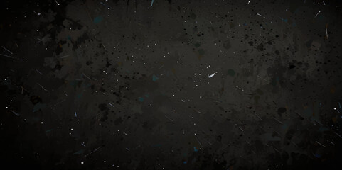 Abstract black distressed concrete wall white particles over isolated black background.