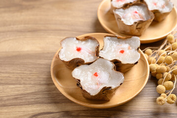 Sticky rice cake with coconut filling on wooden background, Chinese New Year cake