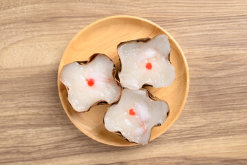Sticky rice cake with coconut filling on wooden background, Chinese New Year cake