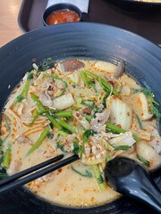 Spicy Noodle Soup with sliced beef and vegetable.