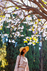 An attractive and cheerful woman feels free and joyful on a good day.