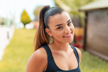 Young pretty woman at outdoors With happy expression