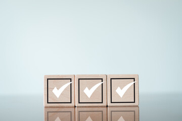 Voting,Task lists, Checklist concept.,Wooden cube with a check mark icon, ideal for showcasing...